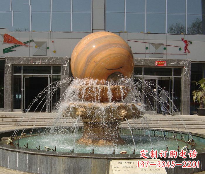 广州石来运转球晚霞红风水球石雕