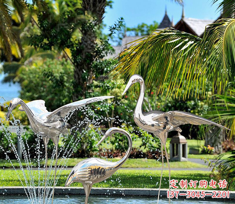 广州鹤雕塑-公园池塘不锈钢镜面抽象喷泉中的鹤雕塑